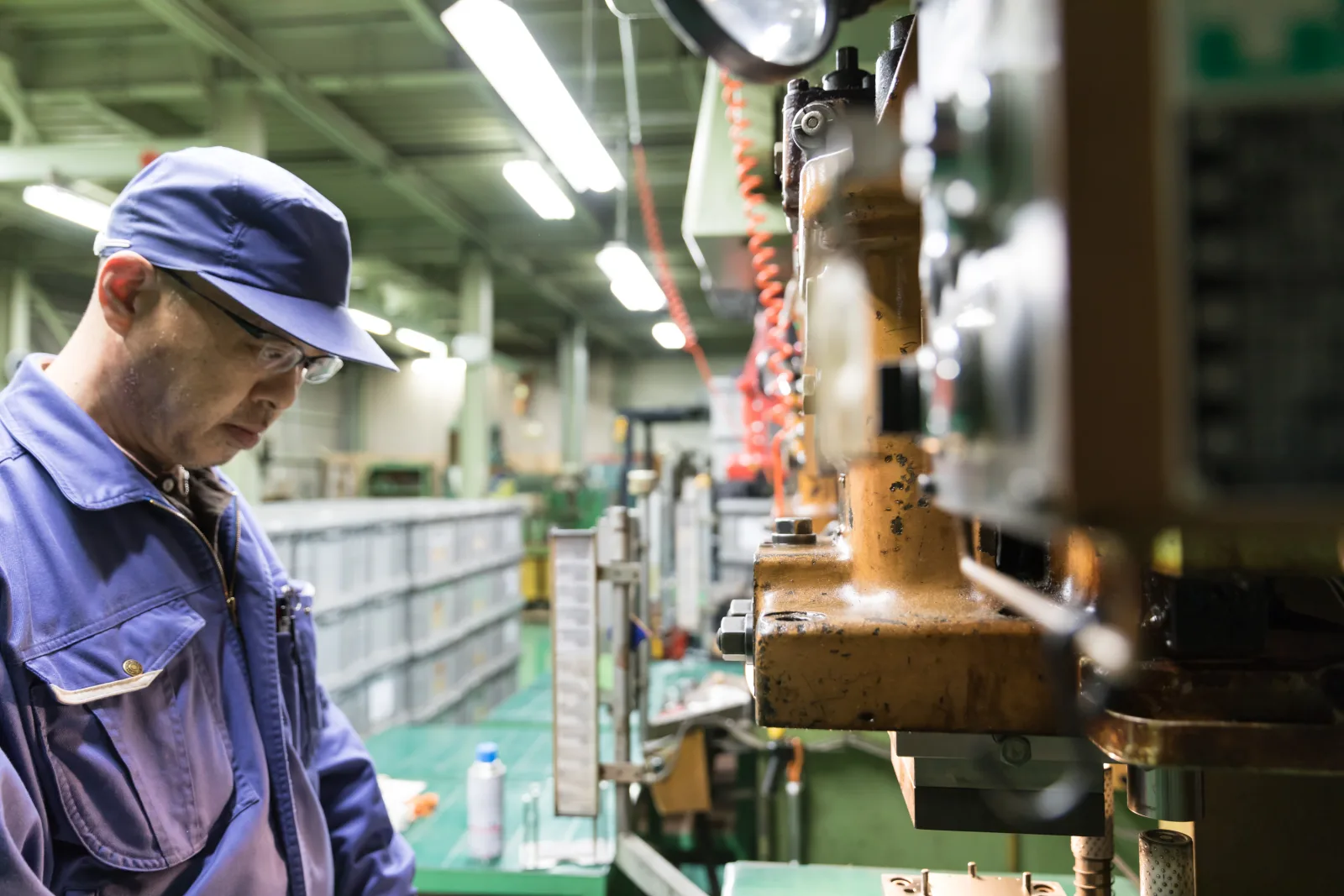 A technician machining a part at Enagic’s factory in Japan